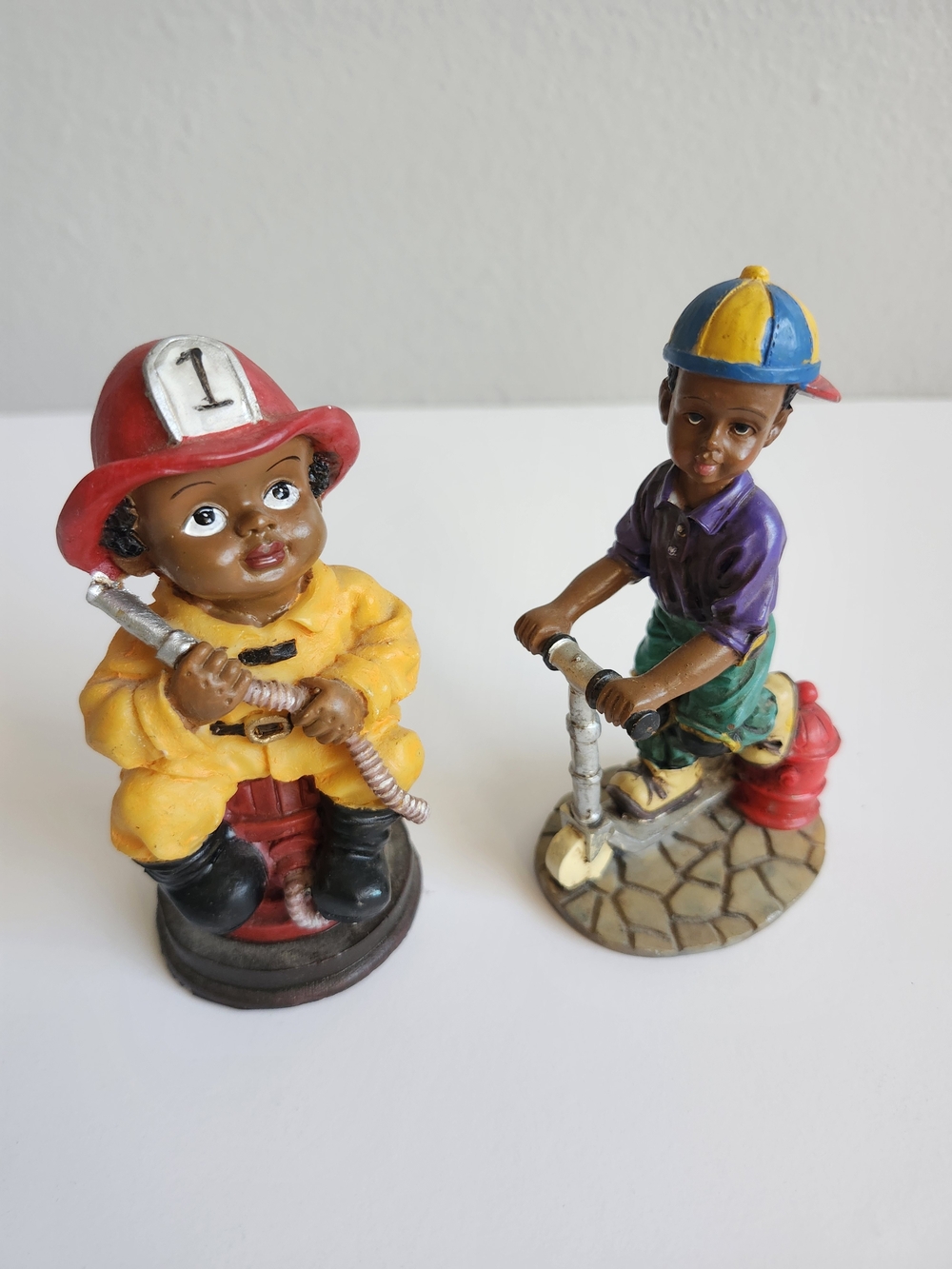 VTG. Yellow Firefighter & Purple Scooter Rider Figurine Set - Hand Painted Décor